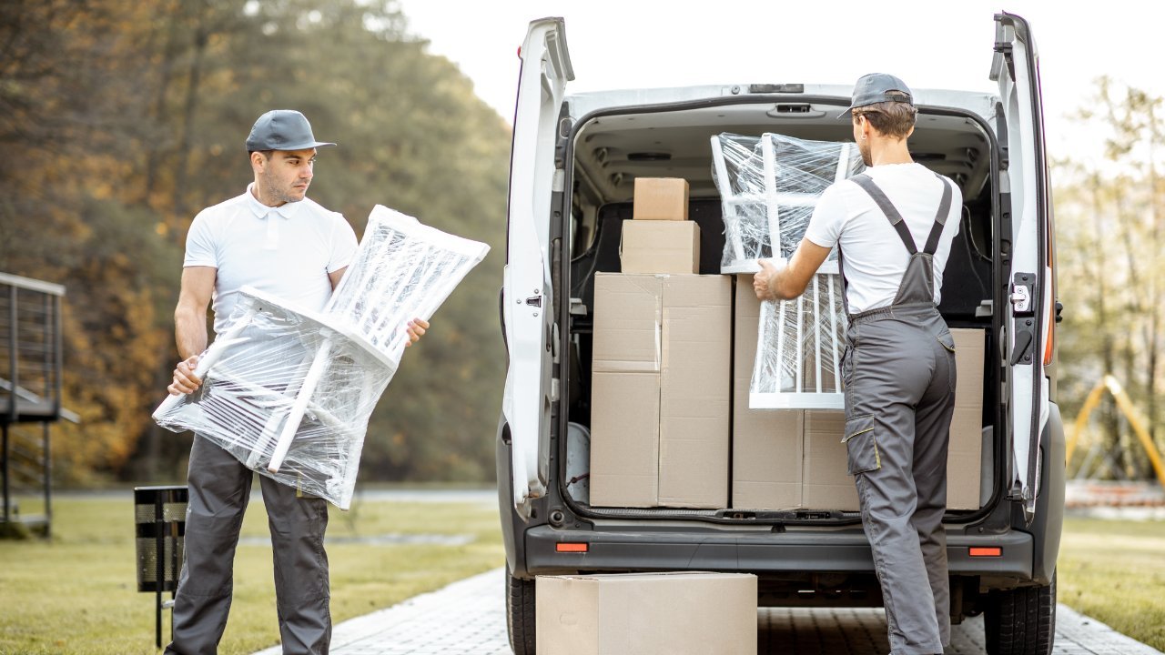 Professional Burly Boyz unloading packed furniture for a local move